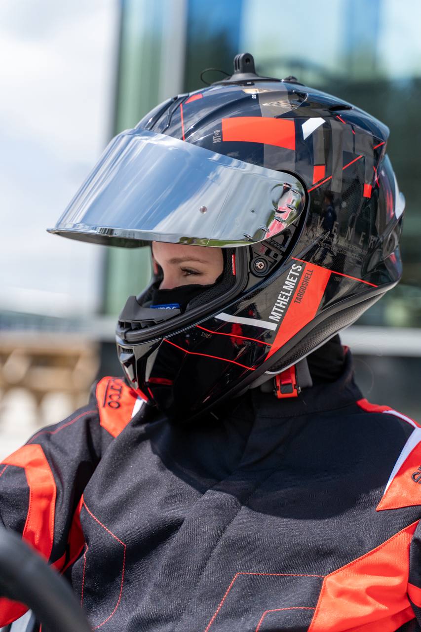 Kseniia wearing a racing helmet